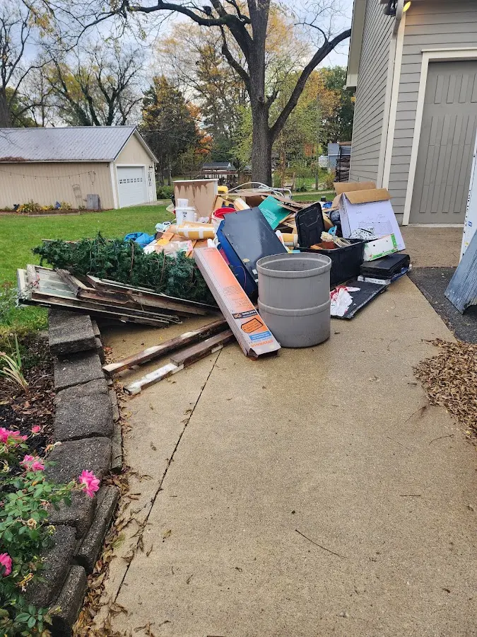 Dumpster being loaded with debris for Residential Dumpster Rental in Odessa